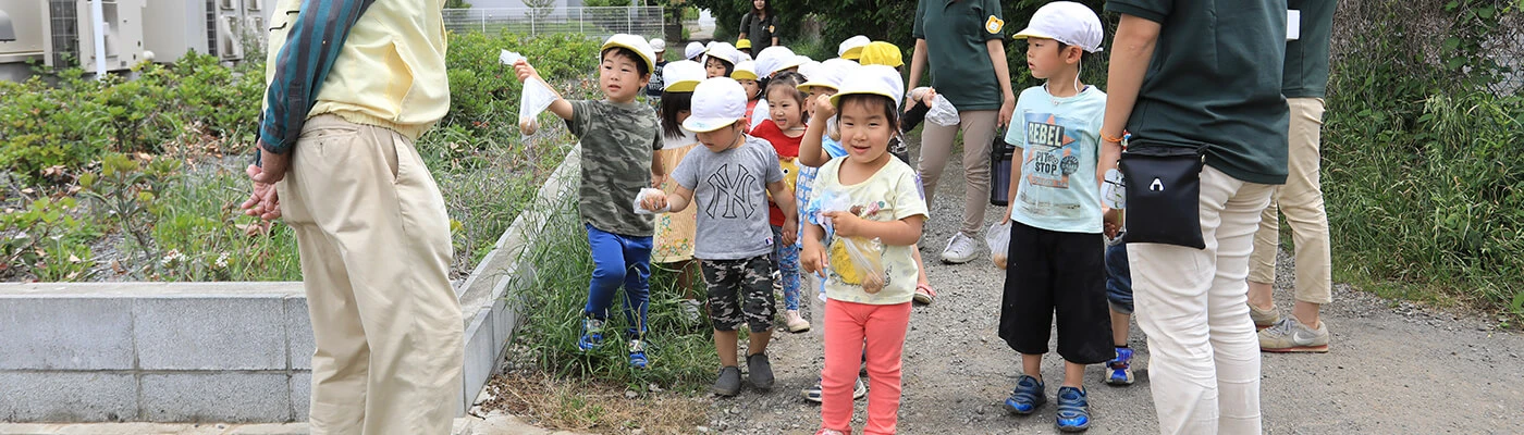 Children walking with staff members