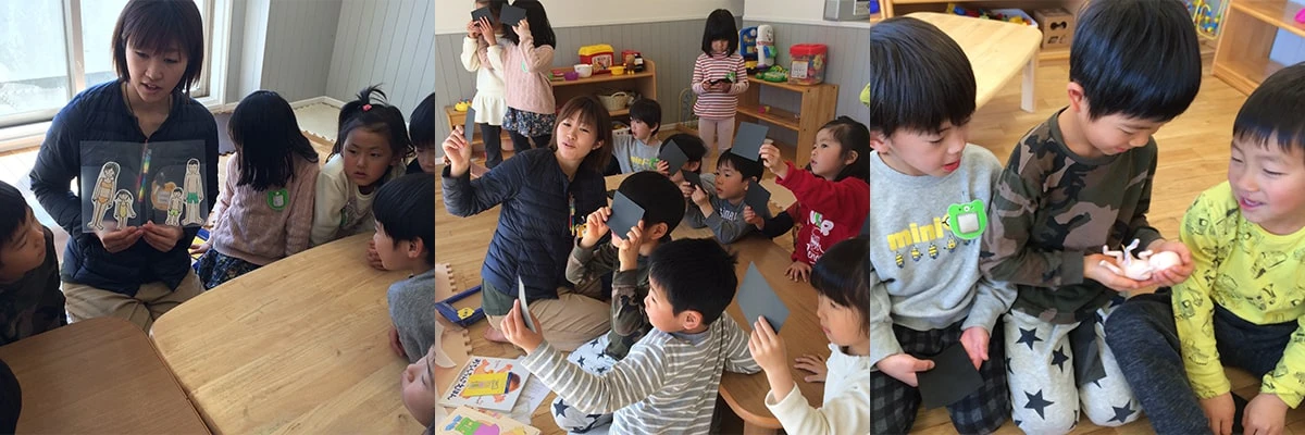 Children and staff using teaching materials during a sex education lesson