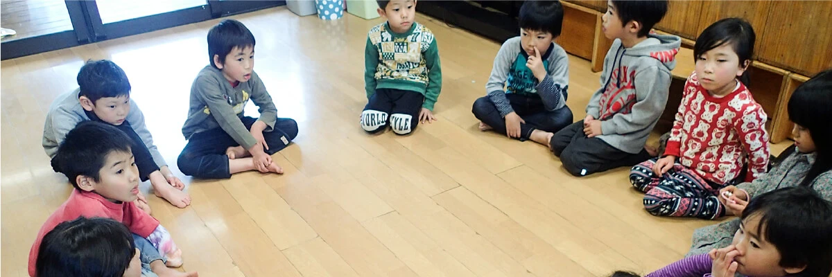 Children sitting in a circle and talking