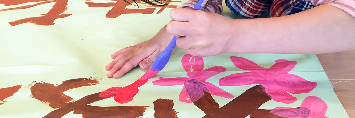 A child painting a flower