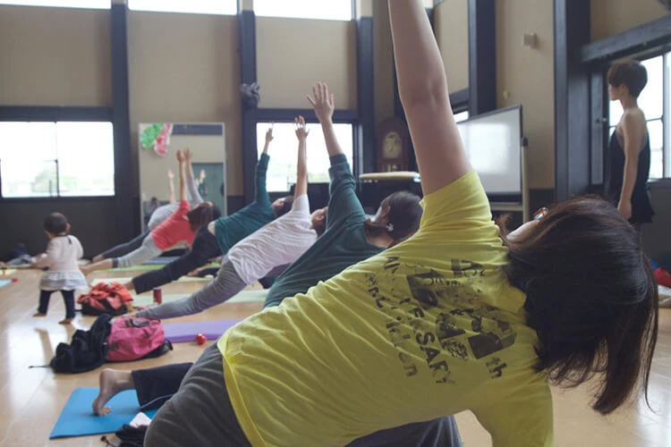 Parents taking part in a yoga session