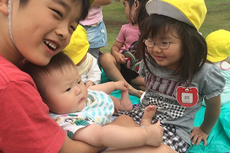 Children of different ages spending time together outdoors