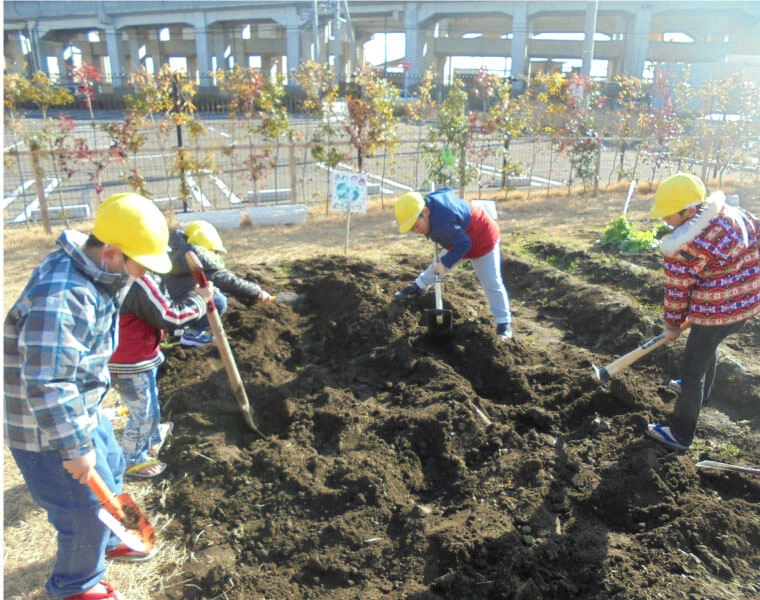 Children tilling a field