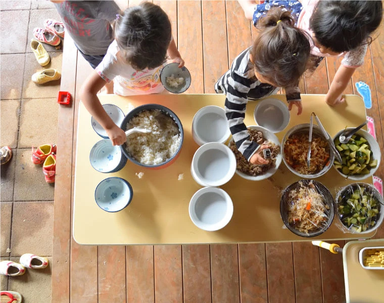 Children serving meals by themselves